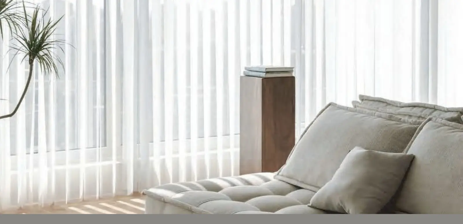 Sheer vertical shades across a wide window